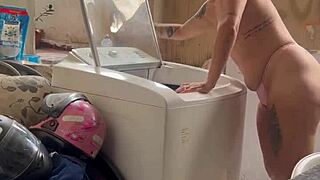 woman washes clothes with tits and pussy out