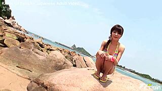 Skinny Japanese chick enjoys beach photoshoot close-ups
