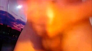 Transsexual in crossdressing attire pleasuring herself with shemale features on display