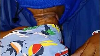 masked lady soaks jacket while sucking big black cock hard!