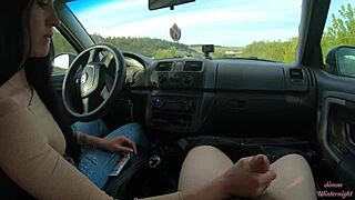 she gives a handjob in the car on the public road