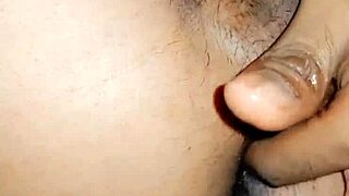 in this homemade video, a feminine sissy fingers her asshole while standing and pissing