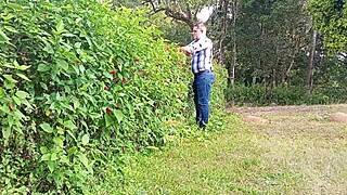 Gardener strokes massive cock to cum on farm