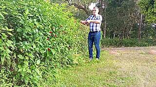 Gardener strokes massive cock to cum on farm