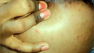 in this homemade video, a feminine sissy fingers her asshole while standing and pissing