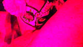 Masked girl sucks cock under red lights 😈