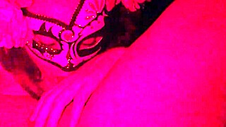 Masked girl sucks cock under red lights 😈