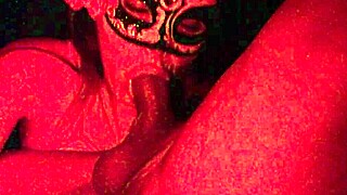 Masked girl sucks cock under red lights 😈