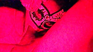 Masked girl sucks cock under red lights 😈