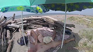 on that nudist beach in tenerife, the stepdaughter jerks her stepfather's cock shamelessly