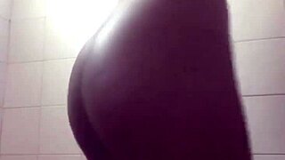 She masturbates in the soapy shower, feeling tight and wet.