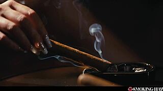 Hey, check out this horny milf with huge tits pleasuring herself and blowing while smoking a big cigar 😈