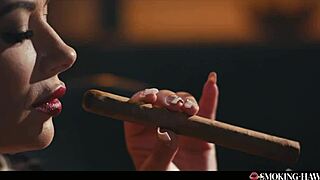 Hey, check out this horny milf with huge tits pleasuring herself and blowing while smoking a big cigar 😈