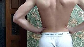Skinny boy flexes in tight underwear