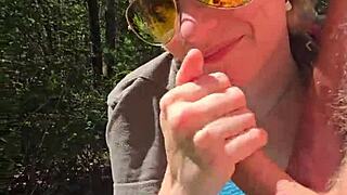 Wife gives handjob outdoors