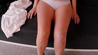 The hot milf strips in lingerie and stockings.