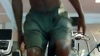 Athletic brunette performs pole dance in the dorm, showcasing her fitness and beauty to roommates