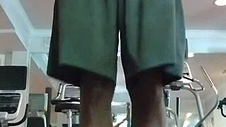 Athletic brunette performs pole dance in the dorm, showcasing her fitness and beauty to roommates