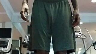 Athletic brunette performs pole dance in the dorm, showcasing her fitness and beauty to roommates