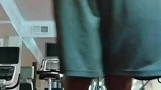 Athletic brunette performs pole dance in the dorm, showcasing her fitness and beauty to roommates