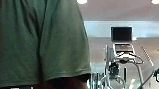 Athletic brunette performs pole dance in the dorm, showcasing her fitness and beauty to roommates