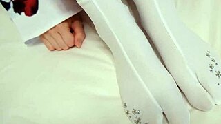 Kimono beauty gives footjob and handjob to amateur guy