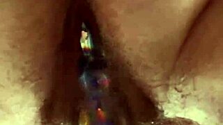 Up close hairy pussy glass dildo masturbation reveals tantalizing contrasts