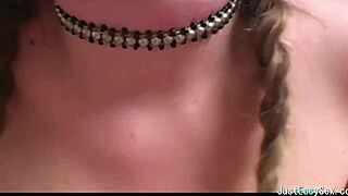 Pigtailed brunette feels pleasure playing with her big tits solo