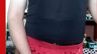 Michelle the transvestite poses seductively in lace skirt lingerie.