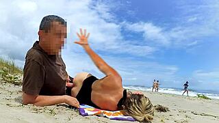 a fat dick in the ass perked up a milf dozing on the beach