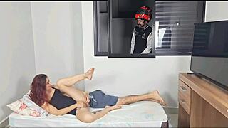 I'm spying on the couple having sex through the open window.