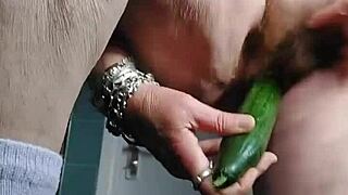 Wow, grandma is fucking her hairy pussy with a cucumber! So intense!