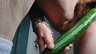Wow, grandma is fucking her hairy pussy with a cucumber! So intense!