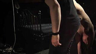 Teeny girl is tightly bound and handcuffed on the bed, getting slapped and whipped before being fucked hard.