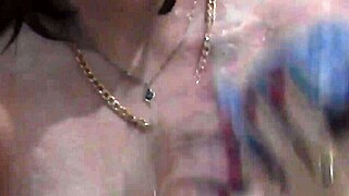 Naked girl bathes with soapy foam on pussy, boobs, and ass