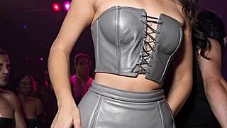 After work, she embraces her dirty leather fantasy, dancing outdoors in boots and skirt, teasing in public.