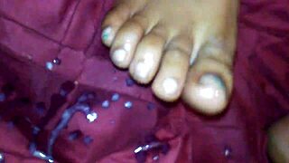 ebony girl gives intense footjob with cumshot