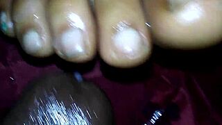 ebony girl gives intense footjob with cumshot