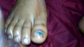 ebony girl gives intense footjob with cumshot