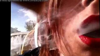 Tina snua smokes a cork cigarette.