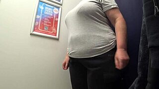 Watch that curvy MILF change clothes in the fitting room, her big ass in satin panties on full display for the voyeur amateur fetish.