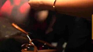 In the night club, a stunning brunette bombshell shakes her huge ass while dancing seductively.