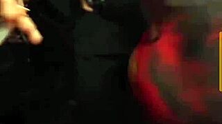 In the night club, a stunning brunette bombshell shakes her huge ass while dancing seductively.