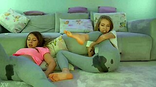 Lesbians masturbate intensely together.