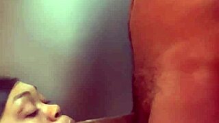 I'm sucking a big black cock in front of the fridge, choking and gagging on it.