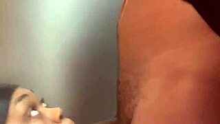 I'm sucking a big black cock in front of the fridge, choking and gagging on it.