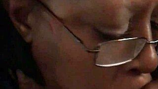 Ebony Woman Engages in Oral Activity with Caucasian Partner