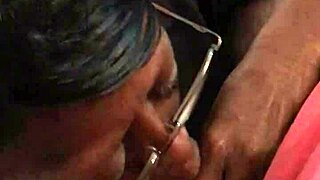 Ebony Woman Engages in Oral Activity with Caucasian Partner