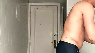 Guy in Black Beach Shorts Shaving on the Beach