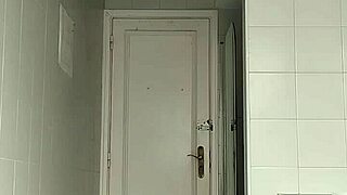 Guy in Black Beach Shorts Shaving on the Beach